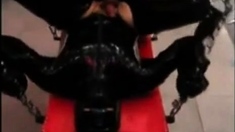 Fucking Latex Slave With A Strapon