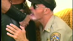 Hard cop gets on the floor to give a barrel-chested thug oral
